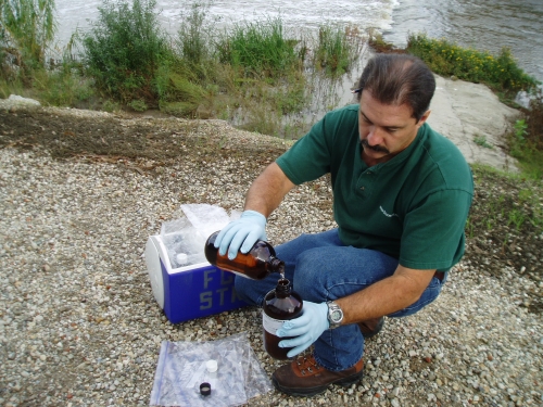 David Thomas pouring a field blank sample at the Calleguas Creek Mass Emission Monitoring Site (Nov. 2005)