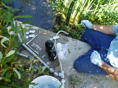 David Thomas preparing to take an equipment blank sample at the Ventura River Mass Emission Monitoring Site (Sep. 2005)
