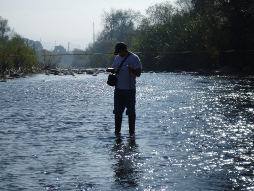 Tommy Liddell measuring flow at the Ventura River Mass Emission Monitoring Site (Jan. 2006)